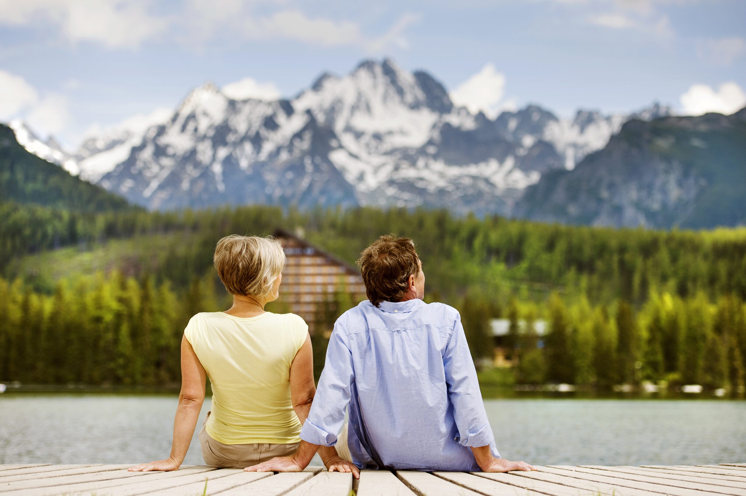Retired couple enjoying peaceful moments by the lake